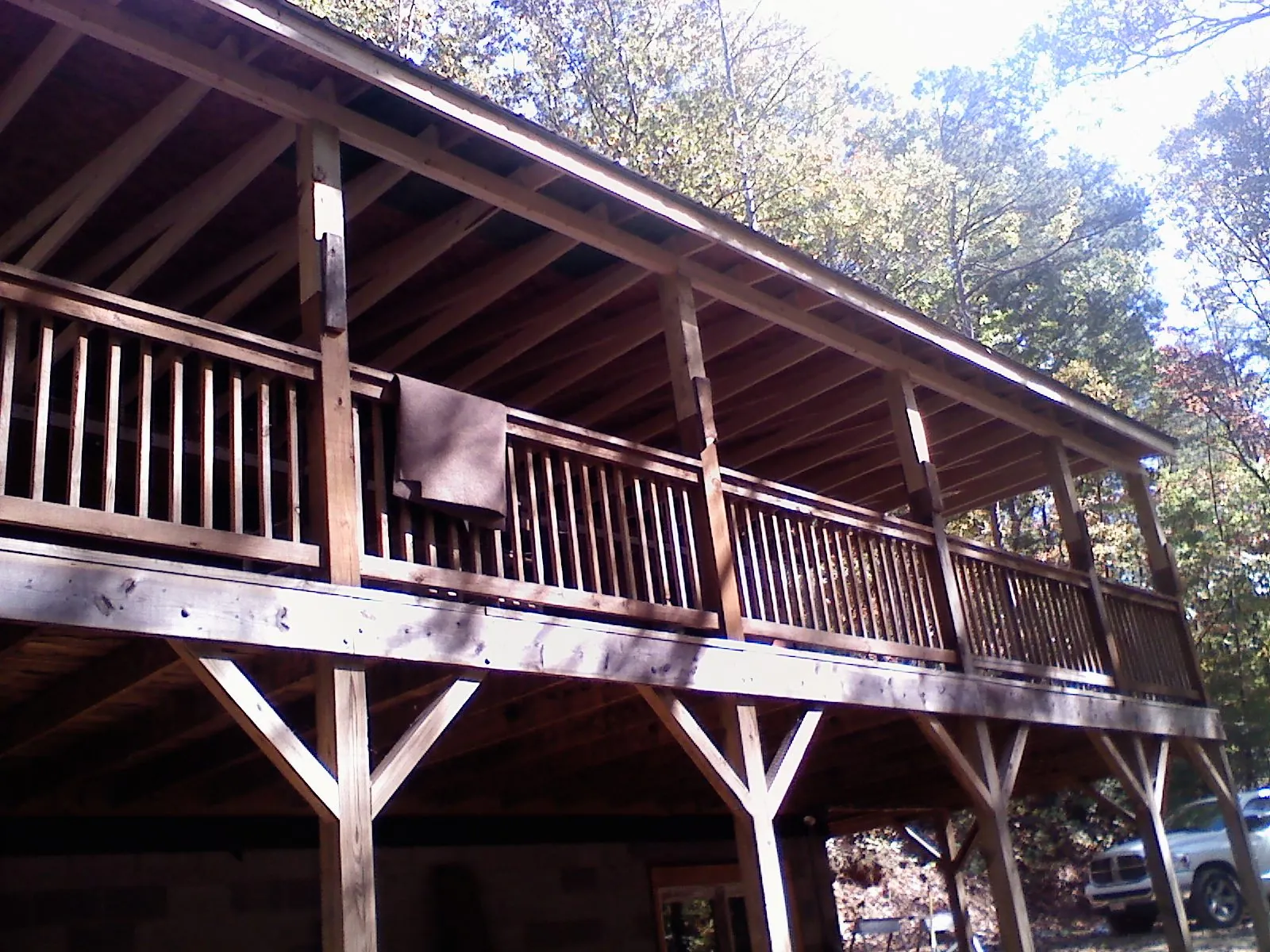 Timber framing under a new elevated porch and deck — Roof Leak Repair in West Newton by Roofing Brothers